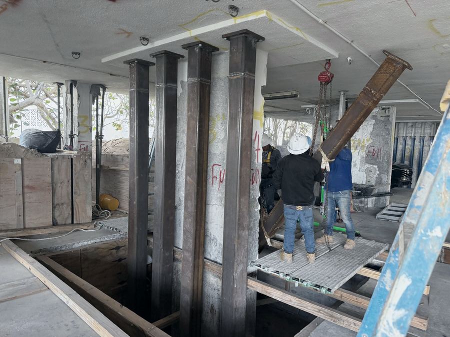 Steel columns being installed to support a restored slab