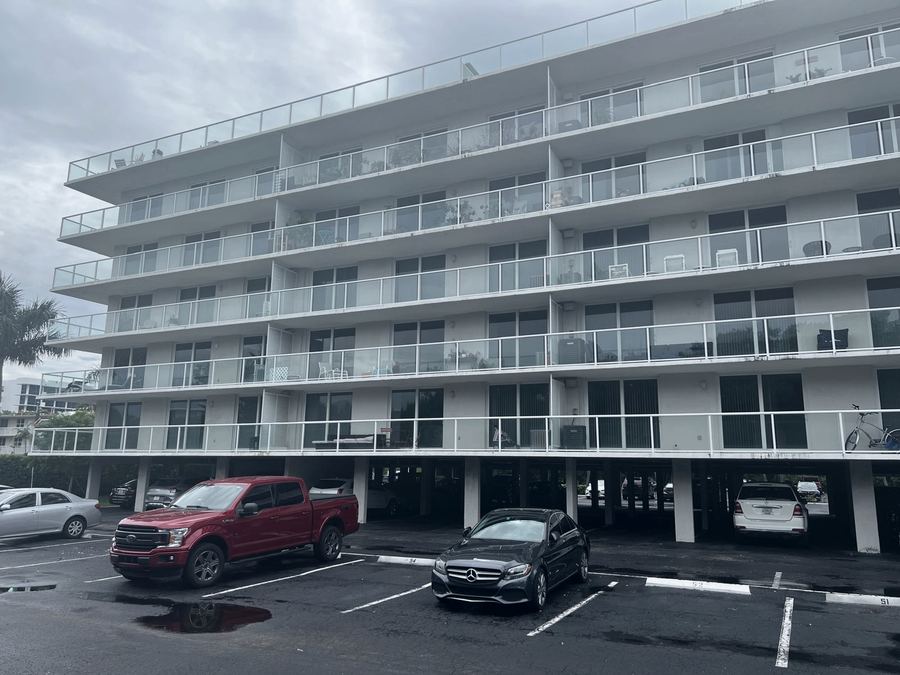 Condominium balconies and glass railings being restored