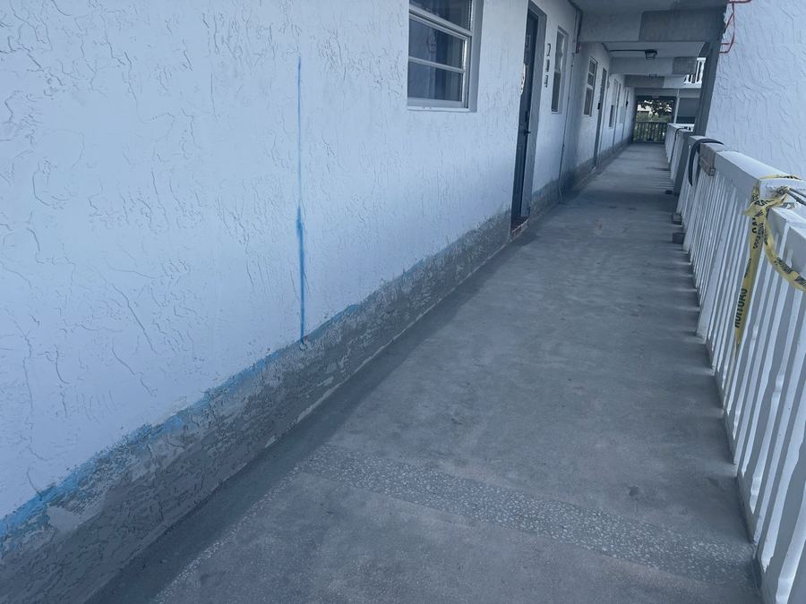 Walkway waterproofing and new coating at the wall base