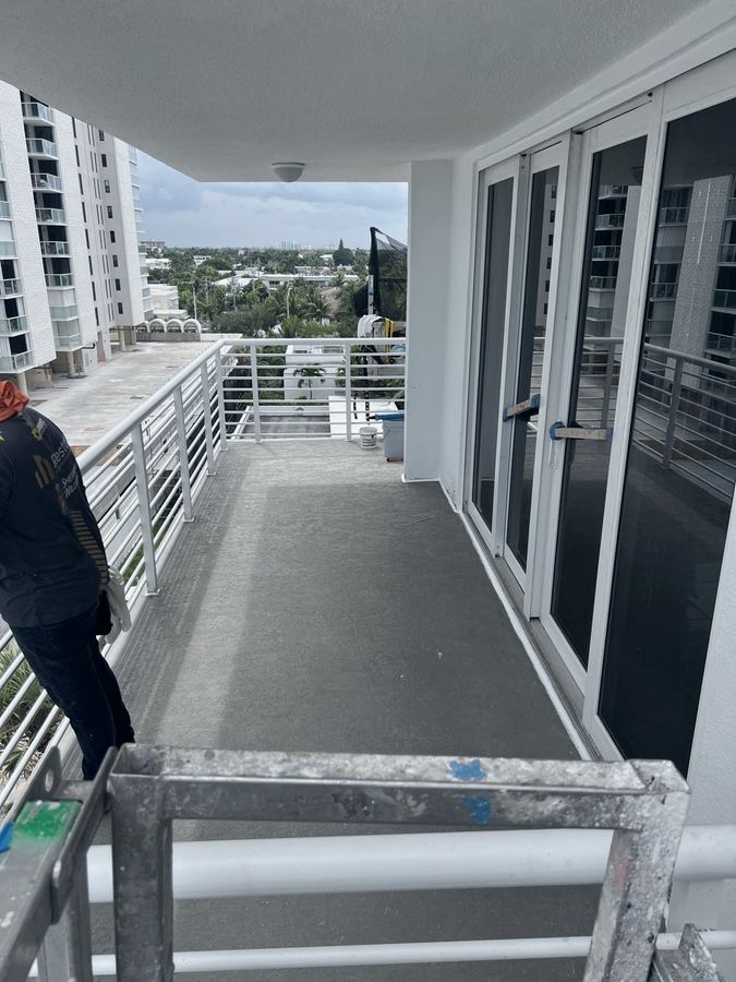 Balcony deck and railing restoration in progress