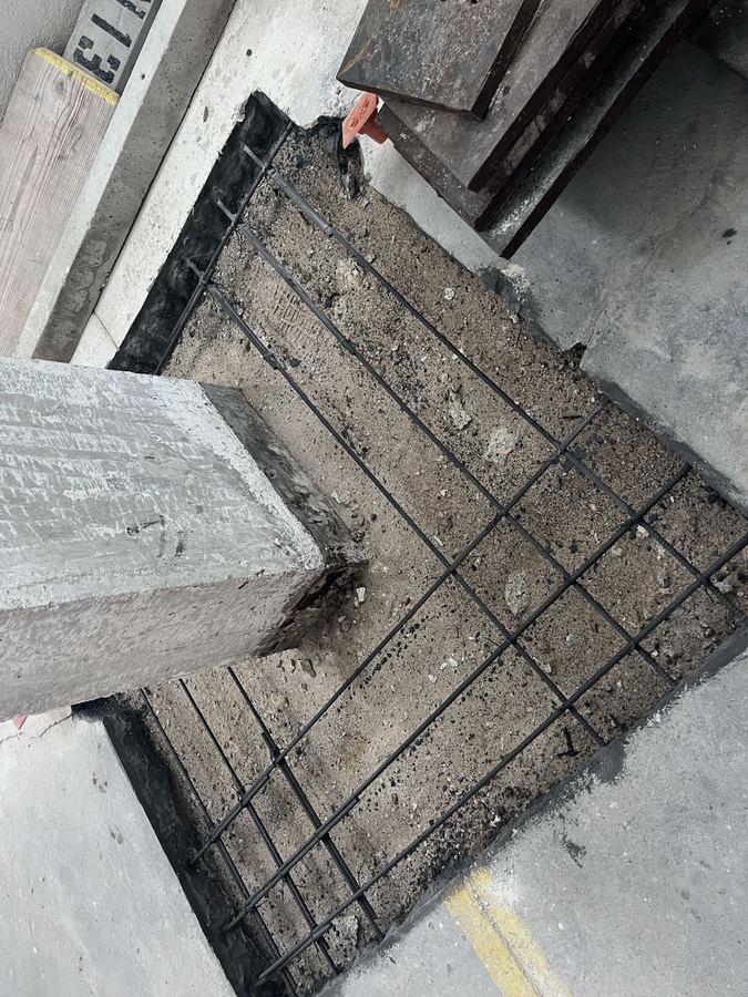 Slab edge concrete repair with new reinforcing steel